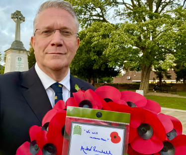 Pictured: Andrew Rosindell M.P. with a Remembrance Day Wreath